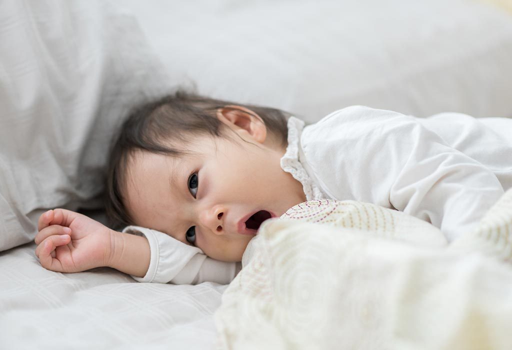 Toddler awake in bed