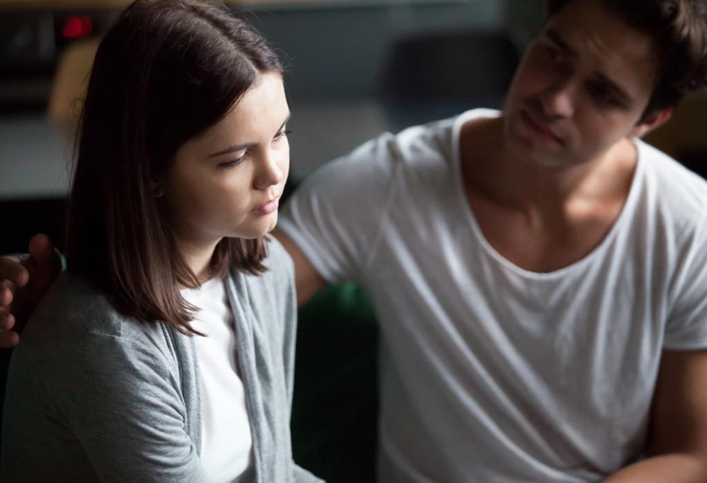 husband consoling wife after a miscarriage